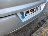 a silver car parked on the side of the road