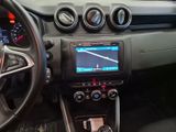 a car dashboard with a steering wheel and a dash board