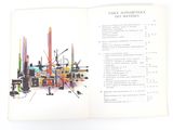 an open book with a picture of a city in it