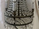 a chandelier that is hanging from the ceiling