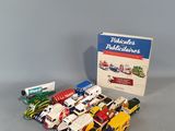 a box of assorted toy cars on a table
