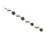 a close up of a black and gold bracelet on a white background