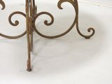 a small table with a glass top on a white floor