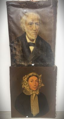 two paintings of a man and a woman are hanging on a wall