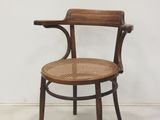 an image of a wooden chair with a woven seat and backrest