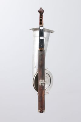 a silver vase with a wooden handle hanging from it