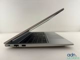 an open laptop computer sitting on top of a white table