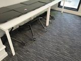 an image of a conference room with a long table and chairs