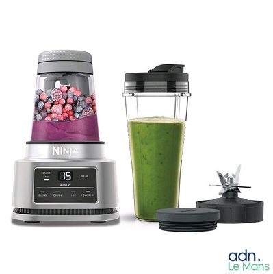 a blender with a green smoothie and a blender with a blender in it