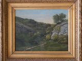 a painting of a mountain scene with trees and rocks in a gold frame