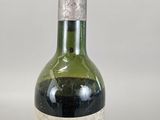 a bottle of wine that is sitting on a table