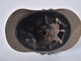 a close up of a hat with a hole in it