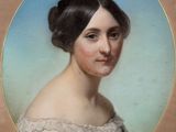 portrait of a woman in a white dress with a blue background