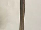 a metal stand with a metal object on top of it