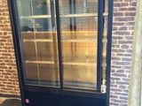 an image of a glass door with shelves in it