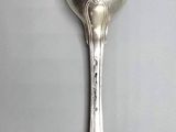 silver spoon on a gray surface