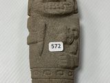 an image of a stone statue of a man with a number on it
