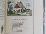 an open book with a picture of a house on it