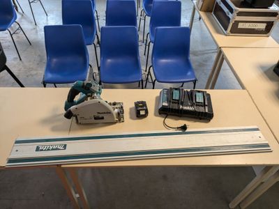 a picture of a table with a circular saw on top of it