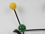 a close up of a pair of pins on a white surface