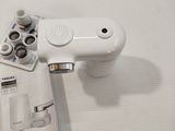 a white wii controller sitting on top of a table