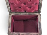 an old silver box with a red velvet lining inside