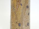 a vase with a brown and black design on it