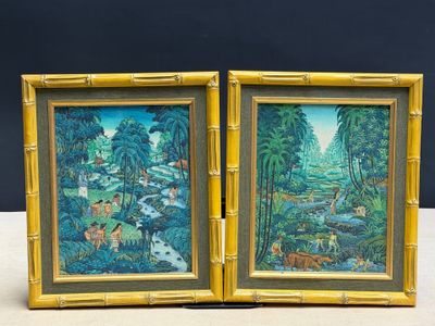 pair of framed paintings of a jungle scene with animals and trees