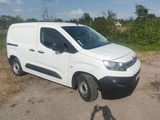 a white van that is parked on the side of the road