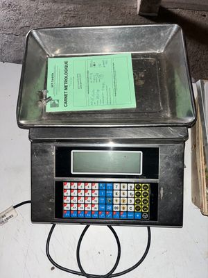 an image of a scale with a calculator on top of it