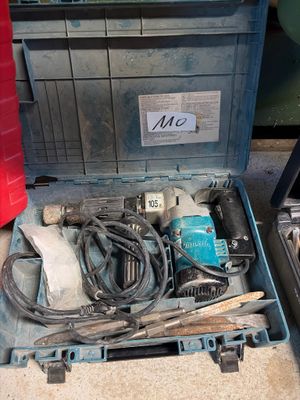 a tool box with tools inside of it on the floor