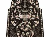 a black and white oriental rug with flowers on it