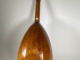 an image of a wooden instrument on a stand against a white background
