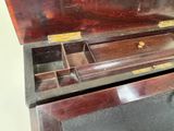 a wooden box with a drawer inside of it