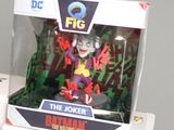 batman and the joker figurines are on display in a box