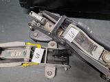 two pieces of luggage sitting on the floor next to each other