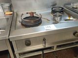 a stove top with pots and pans on it in a kitchen
