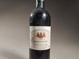 a bottle of wine that is sitting on a table