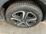 a close up of a tire on a car ' s rim