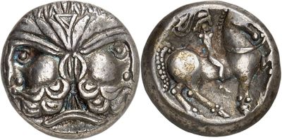 a close up of a coin with a horse on it