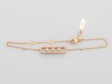 a gold plated bracelet with a diamond clasp