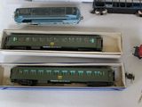three train cars that are sitting next to each other
