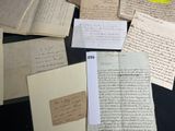 a lot of old papers that are on a table