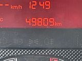 a close up of a car ' s dashboard with the time displayed