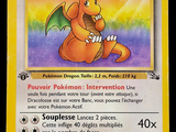 pokemon card with a picture of a dragon sitting on top of it ' s back