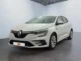 une voiture blanche dans une pièce blanche au sol noir