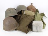 a pile of military items on a white surface