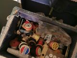a box full of sewing supplies sitting on a table
