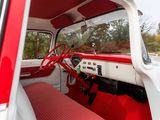 a red and white car with a red steering wheel