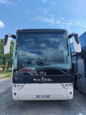 two buses parked next to each other on the side of the road